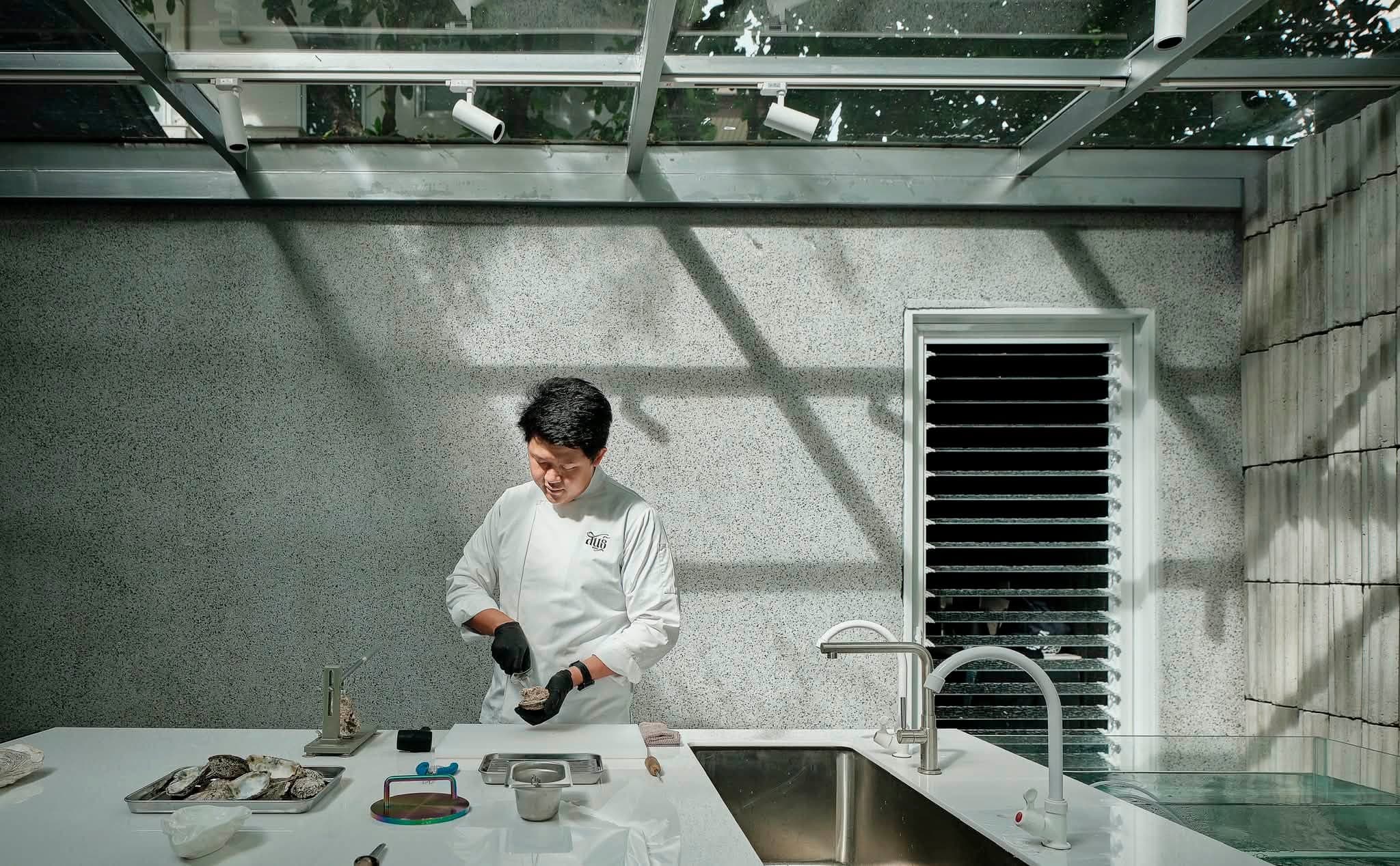 Chef Boss prepping oysters, Bangkok kitchen