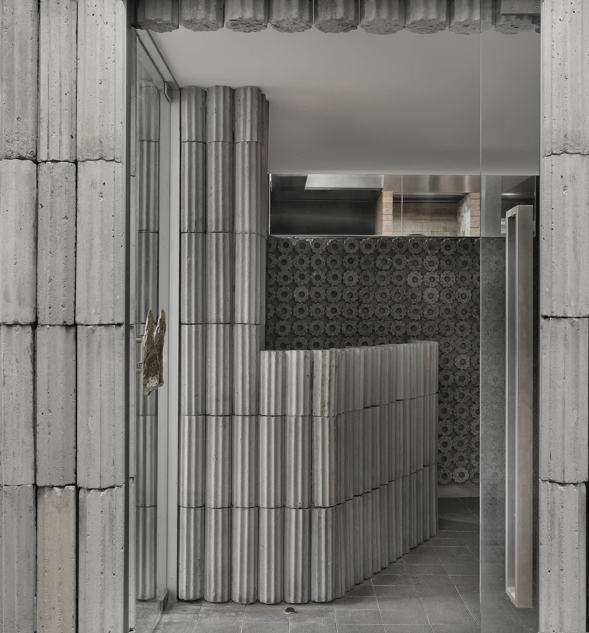 Fluted concrete columns, Bangkok dining room